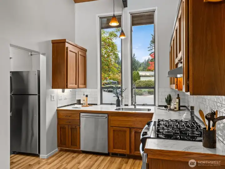 Once upstairs, the nice sized kitchen is immediately to the right, overlooking the gorgeous garden out front.
