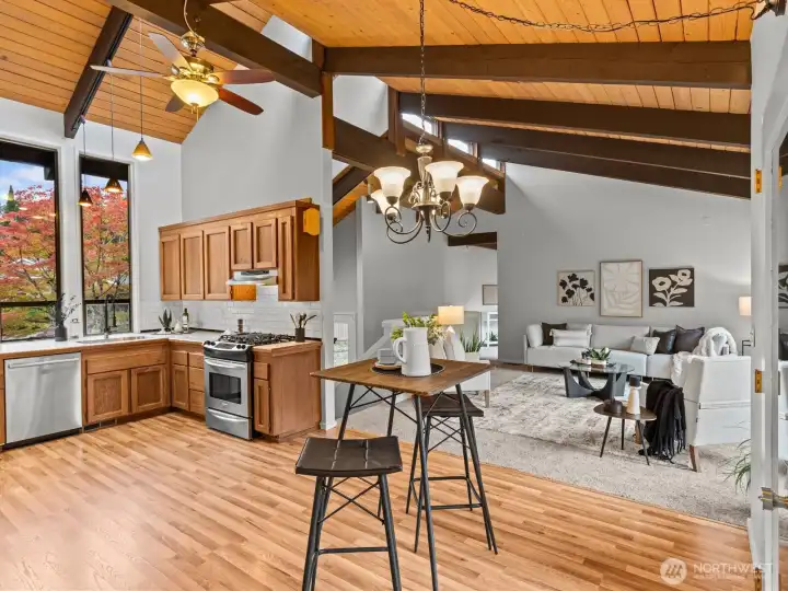 Stunning beams paired with the soaring cedar lined vaulted ceilings bring so much character to the open floorplan.