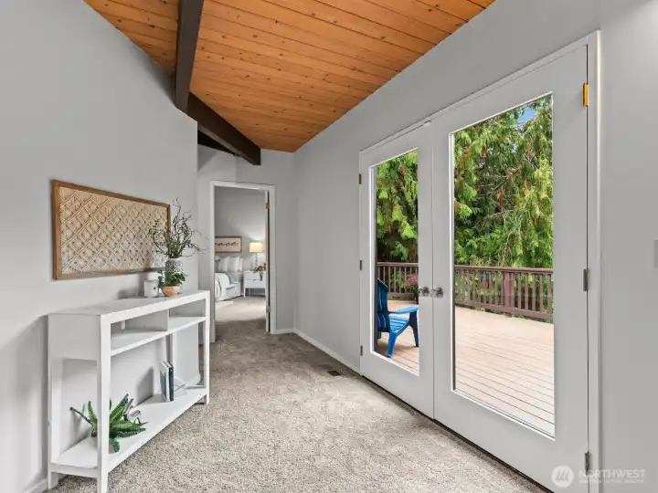 Just around the corner is the generously sized back deck on your way to the main floor bathroom and primary bedroom.