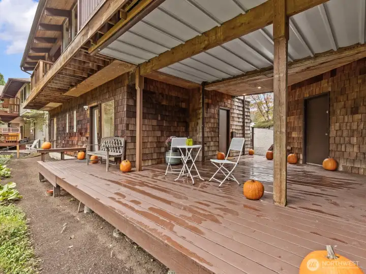 The low maintenance backyard overlooks a creek at the base of the slope.