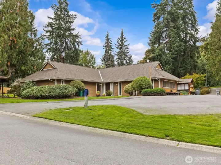 A clubhouse with a large parking lot is just one of the amenities.
