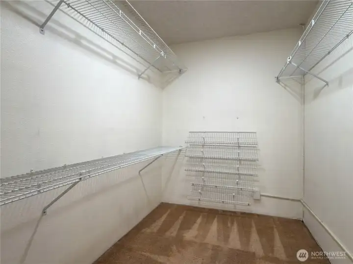 Extra-large walk-in closet off of the Primary bedroom.