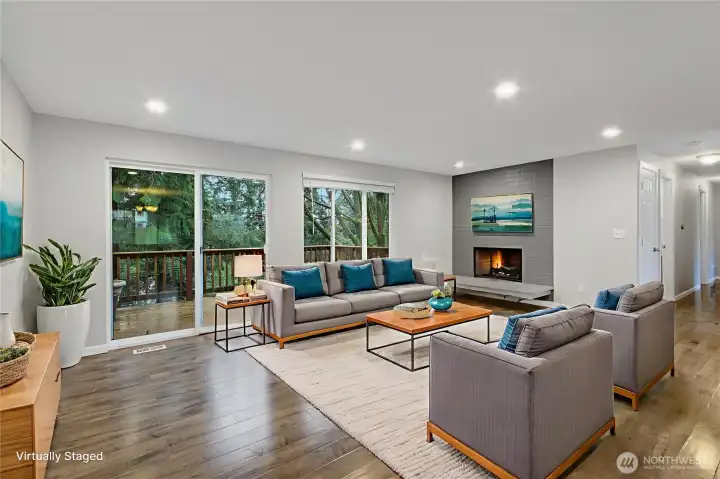 Large Living Room with fireplace and slider out to Upper Deck. *Virtually Staged*