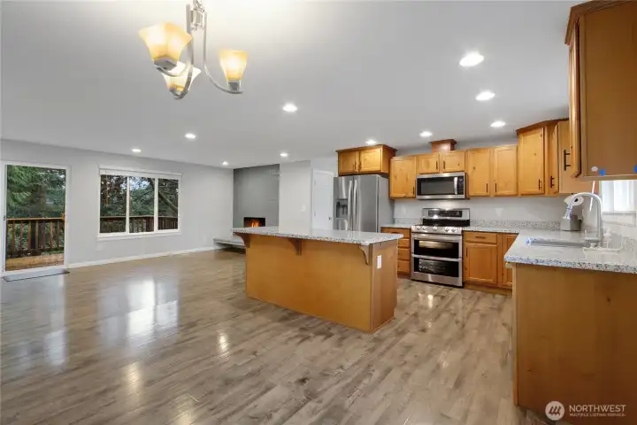 View of Kitchen, Living Room and Dining room. One large great room for entertaining.