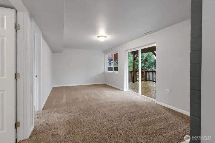 Downstairs Living Room with sliding door to lower deck and backyard.