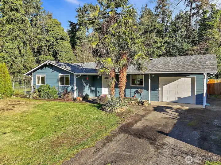 Surrounded on two sides by trees.  Very private.  This home has two tax parcels included.