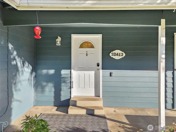 Very lovely covered front porch area.