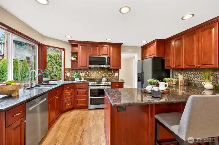 This view reinforces the kitchen’s practical layout and the quality of the finishes. The window placement brings in natural light right where you spend time, which keeps the space feeling bright even on gray Northwest days. Everything feels clean, cohesive, and move in ready.