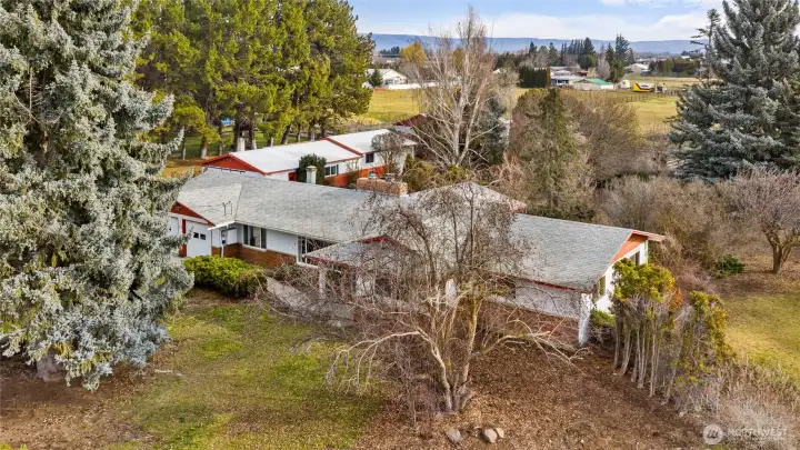 Home with garage, and multiple shops!