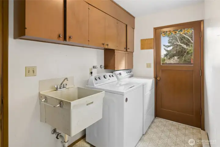 Laundry room has a lot of storage including a closet not shown in this photo!