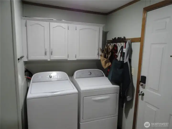 Utility room includes new washer and dryer