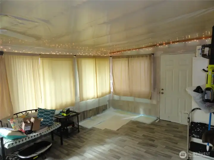 Inside the bonus room from the primary bedroom.  This is ready for sheetrock!  Use this as extra storage or bring your plants and let them soak up the abundance of sunshine!