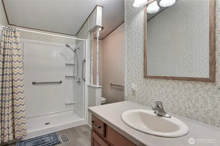 Updated Ensuite Primary Bath! No more tub in this bath, walk-in shower and also solid-surface vanity, lovely!