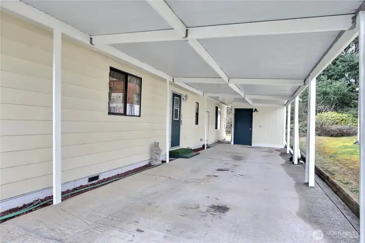 Carport view, great size! 2 cars can easily park here, nice storage shed at the rear.