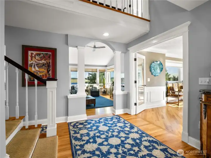 Wainscoting, architectural details such as arched doorways and decorative pillars are sprinkled through out this home.