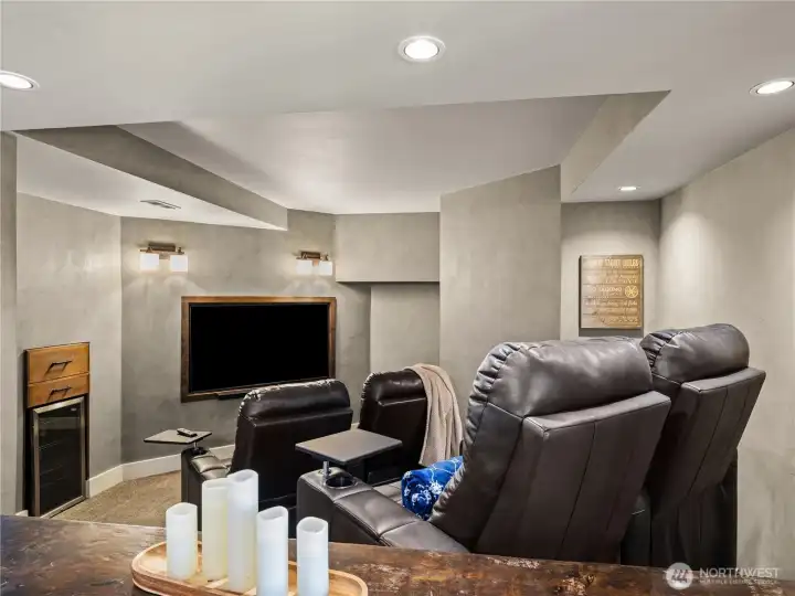 You have a small wine cooler at your disposal  in the movie room.