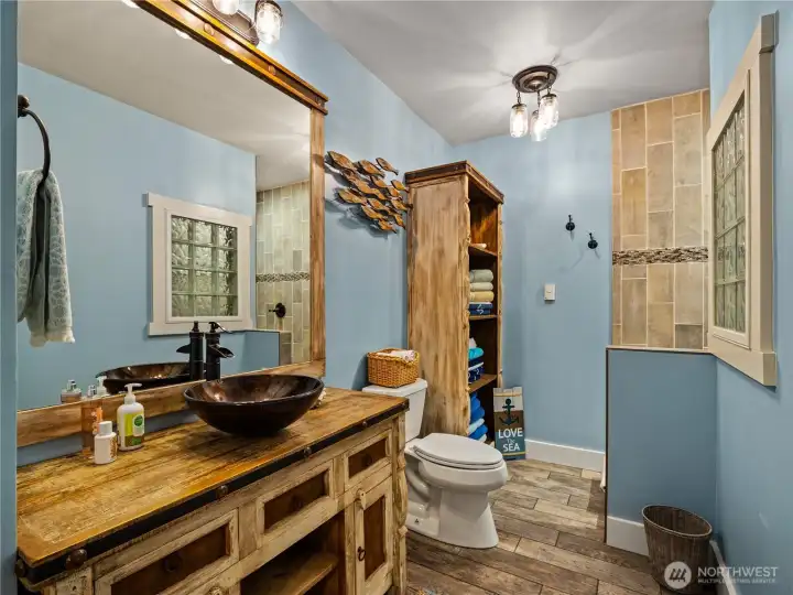 Lower level bathroom with walk in shower.