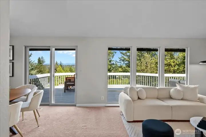 Step inside to be greeted by a sweeping mountain and terratorial view - including a peek-a-boo view of Lake Sammamish.