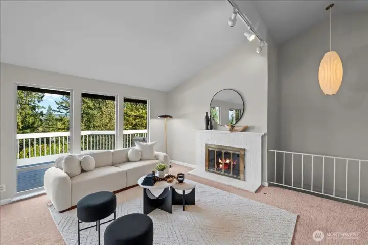 The vaulted ceilings and wall of windows create a bright floor plan, flooding the rooms with natural light. You will appreciate the custom touches like the George Nelson lighting fixture