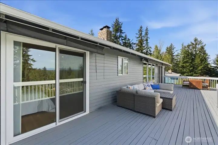 Oversized entertainment deck off the living room and primary bedroom