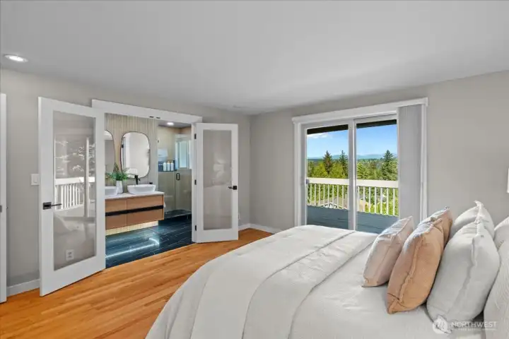 Double doors lead to the custom remodeled bathroom with tile shower, heated floors and the 2nd closet