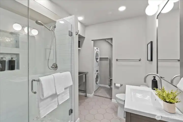 The lower level 3/4 bath features heated floors, tile shower, beautiful vanity and lighting plus a 2nd washer & dryer. The lower level is perfect for long term guests to have their own self-contained space