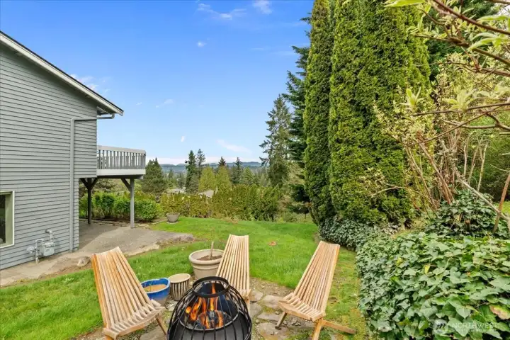 Enjoy relaxing around the firepit while taking in the terratorial views from the private backyard