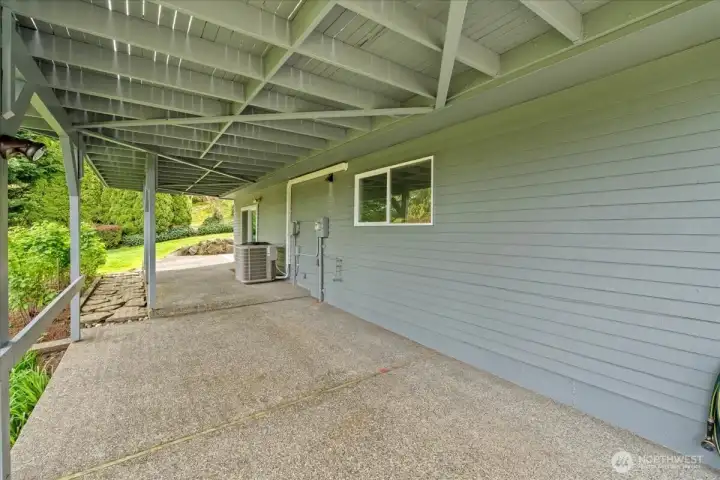 The patio space under the deck can also be used for extra parking with access directly from the driveway
