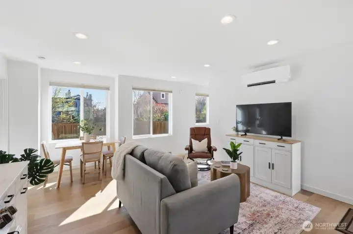 Notice the mini-split for AC and the large vinyl windows for territorial views and natural light.