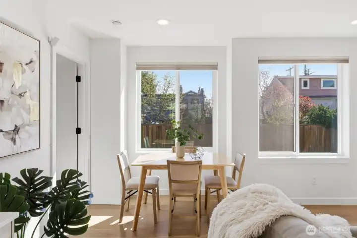 Hunter Douglas blinds are installed on each window; enjoy your morning coffee in the sunny eating nook.