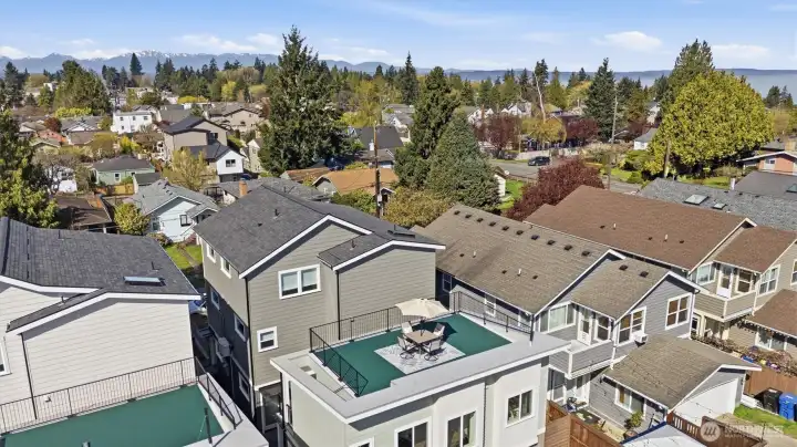A photo capturing Olympic Mountain Views towards Golden Gardens Park.