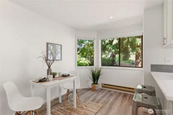 Adjacent to the kitchen is this informal eating area. Perfect for enjoying a quick bite or morning coffee. Just off camera is a spacious pantry.