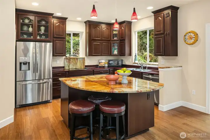 Stunning, colorful granite with bamboo floors.