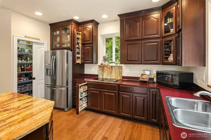 Special details in this kitchen -- wonderful pull out spice racks and extra large walk in pantry.