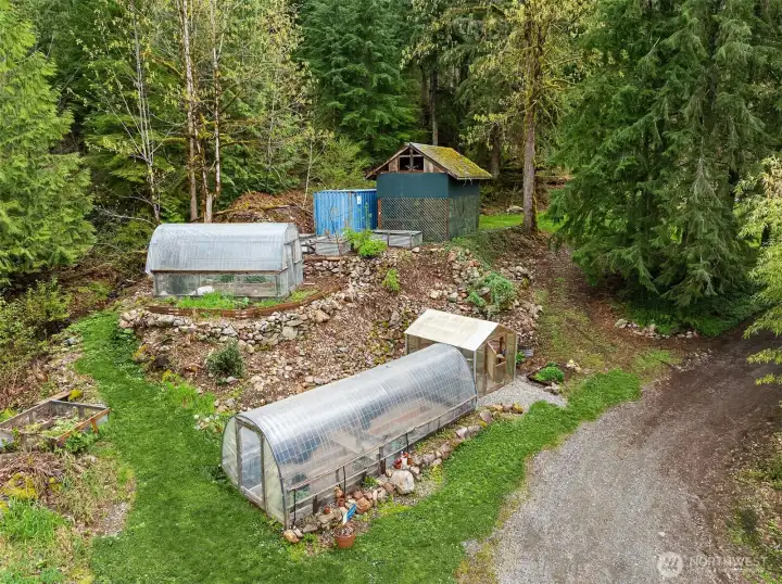 Designed for function and production.  two hoop houses, outdoor raised beds, compost bins.  Sellers are organic growers.