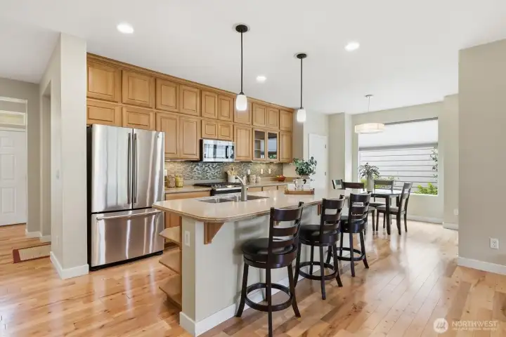 You can never have too much cabinet space. This home's solid wood cabinets are almost floor to ceiling and provide tons of valuable storage. Also pictured is the sweet walk-in pantry. You can never have too much cabinet space. This home's solid wood cabinets are almost floor to ceiling and provide tons of valuable storage. Also pictured is the sweet walk-in pantry.