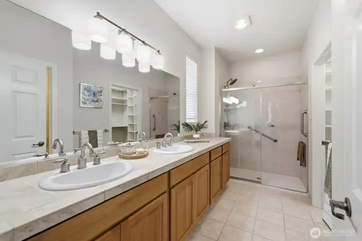 Dual vanities and a brand new Bathfitter Shower system highlight the primary suite's bathroom. There is plenty of room here to share. Dual vanities and a brand new Bathfitter Shower system highlight the primary suite's bathroom. There is plenty of room here to share.