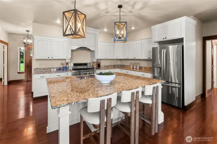 Beautiful Kitchen w/ granite slab counters. Oversized island w/ room for barstools.