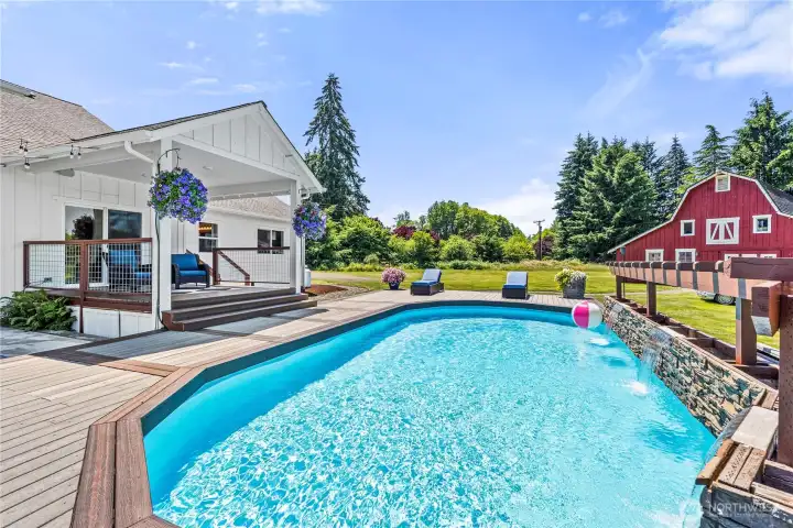 Pool is surrounded by Trex deck, perfect for soaking up all the summer sunshine.