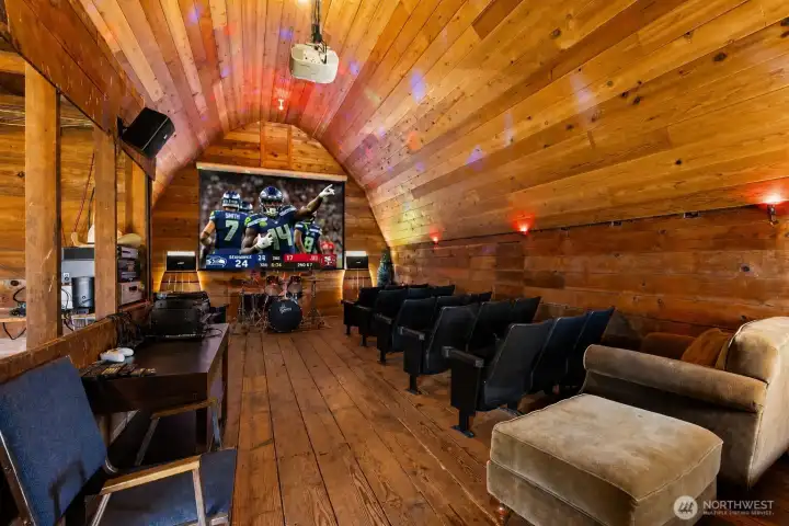 Theater room in the barn! Watch the big game, karaoke or have a band session, this is an epic space! Includes 27 theater chairs from an old cinema.