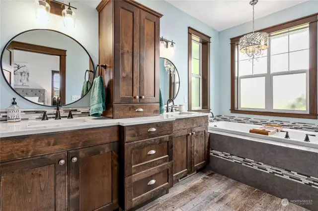 Ensuite bath has tons of cabinet storage, huge garden tub, & again tons of windows!