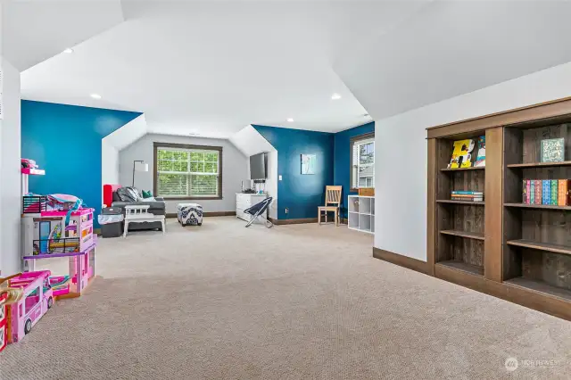 Need somewhere for teens to be rowdy? This over 250 sq ft +/- bonus room has tons of windows, custom built-in shelving & plenty of room