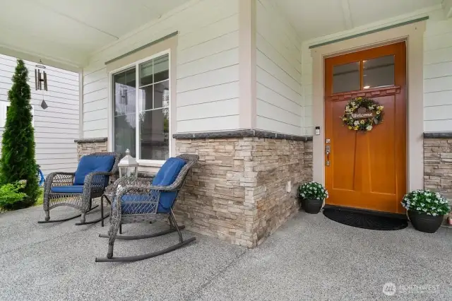 Front covered porch with oak door