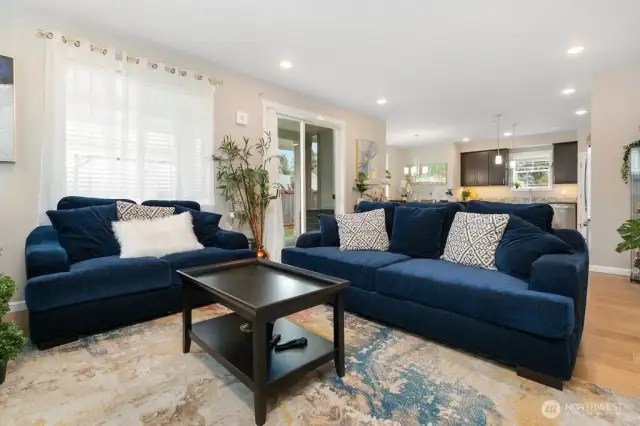 Open concept living room with access to back yard covered back patio