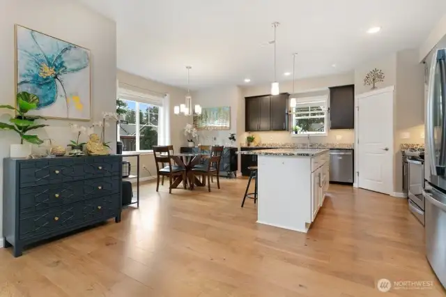Kitchen with dining room and island and stainless steel appliances
