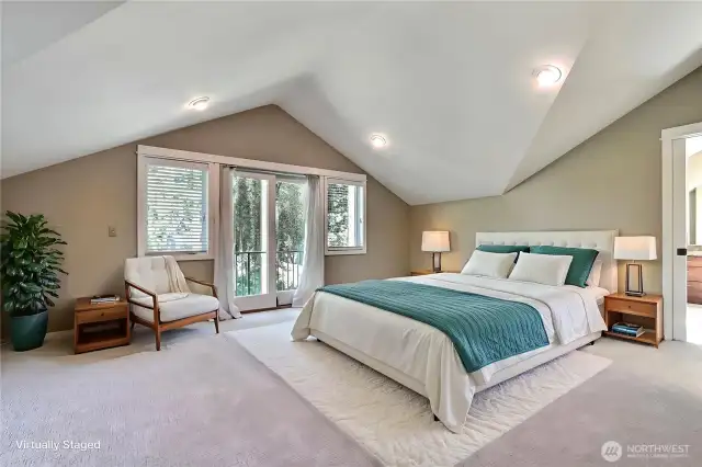 Upstairs you will find your massive primary suite, featuring dramatic vaulted ceilings, a Juliet balcony, and spacious ensuite primary bath. A private oasis! ***Virtually Staged***