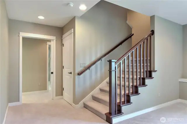 As you head downstairs from the main level, you will find a large bonus/rec room and hallway to additional bed, bath and even more!