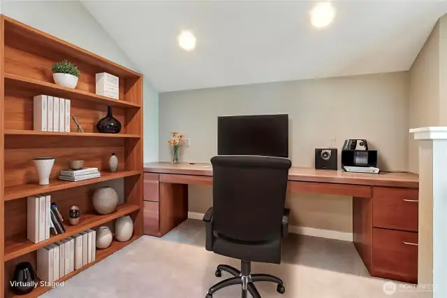 Off of the lower rec/bonus room you will find this office/den with built-ins. ***Virtually Staged***