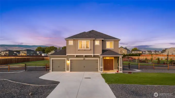 Shy acre with beautiful landscaping. Fully fenced with added concrete curbing/gravel for a modern and clean look.