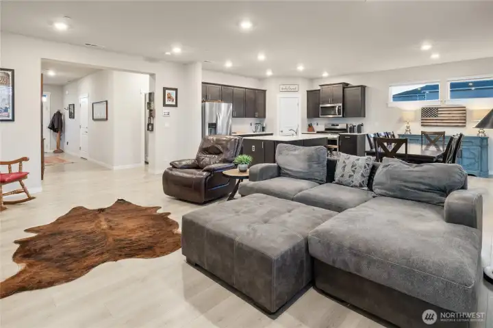 Living area with electric fireplace/ large windows for natural light
